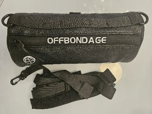 Verified buyer photo of the black handlebar bag on a table