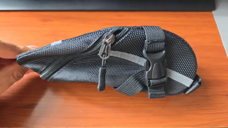 Verified buyer photo of the saddle bag showing its shape held in hand